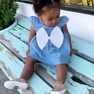 Blue dress with white bow
